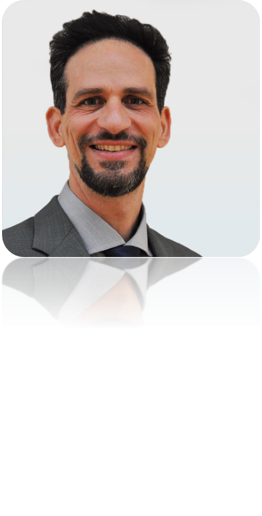 A person smiling for the camera Description automatically generated with low confidence